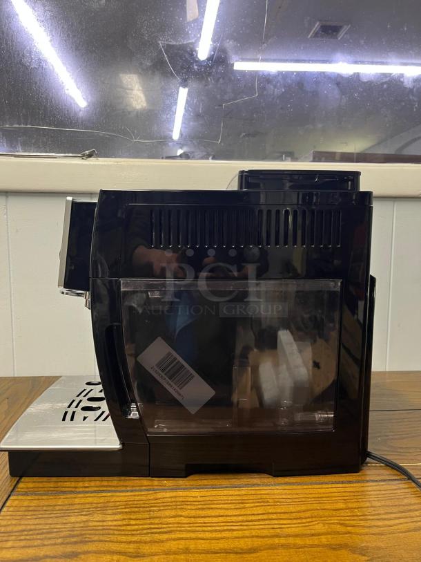 De'Longhi Magnifica S Automatic Espresso Machine, black color, built-in grinder, side view, used condition.