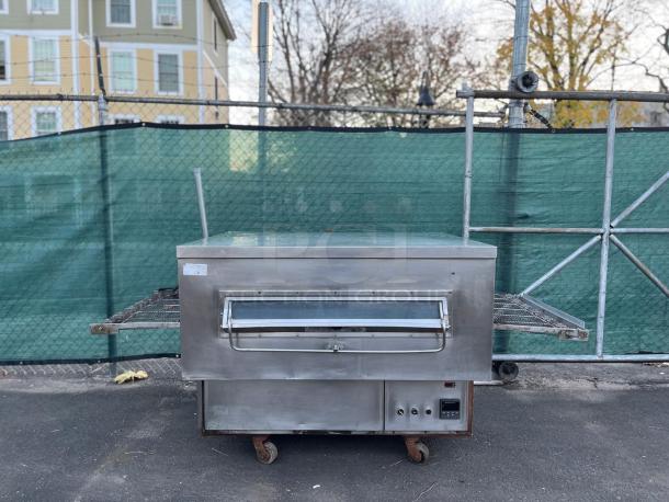 Middleby Marshall PS360G gas-fired impingement conveyor oven, commercial-grade, visible wear, for high-volume rapid cooking.