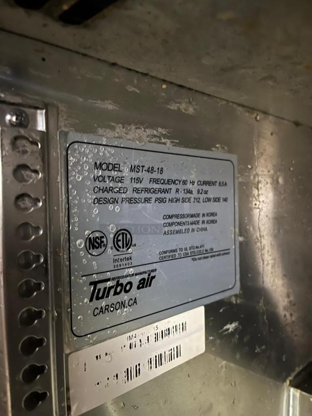 Turbo Air MST-48-18-N prep cooler label indicating model, voltage, refrigerant type, design pressure, and certifications.
