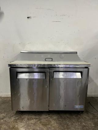 Turbo Air MST-48 M3 Series 48in prep table, stainless steel, dual compartments, visible wear, branding label lower right.