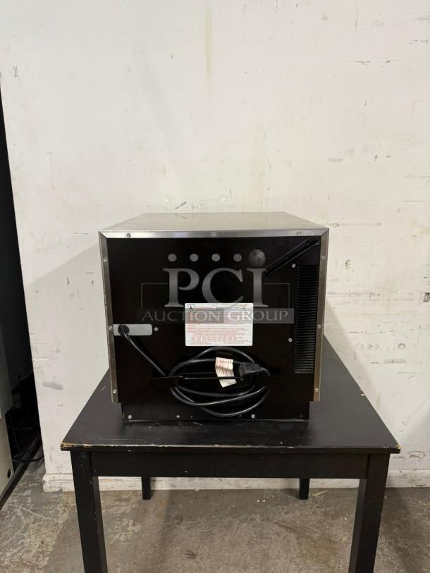 MENUMASTER RC17S2 19" 1700W commercial microwave in good condition, rear view showing power cord and vent.