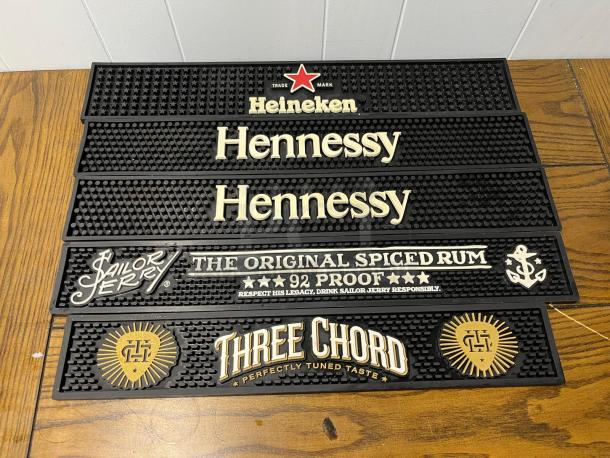 Bar runners featuring logos: Heineken, Hennessy, Sailor Jerry, Three Chord. Black, rubber material, good condition.