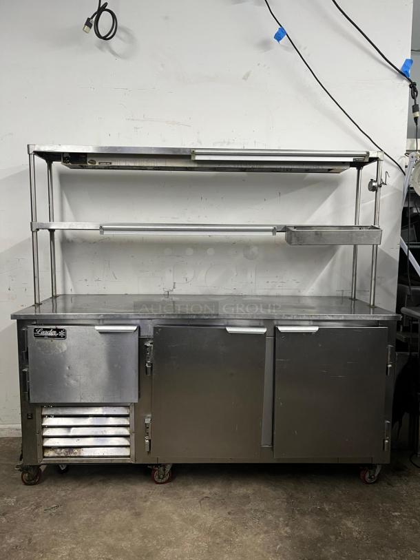 LEADER LB72 72" low boy worktop refrigerator with two full doors, a half door, double overshelves, and heat lamp in good condition.