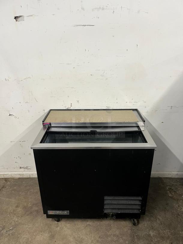TRUE T-36-GC-HC 36" Black Glass Froster/Plate Chiller, stainless top, on casters, used condition, visible brand logo.