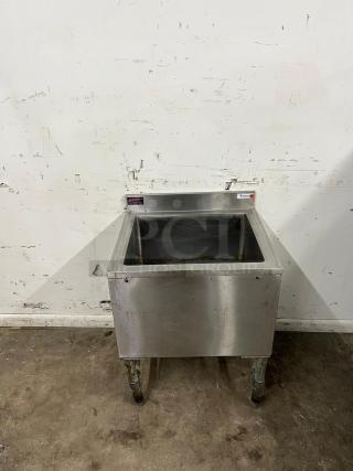 24-inch stainless steel cold plate ice bin with drain by COLD PLATE. Features visible wear and rust on legs.