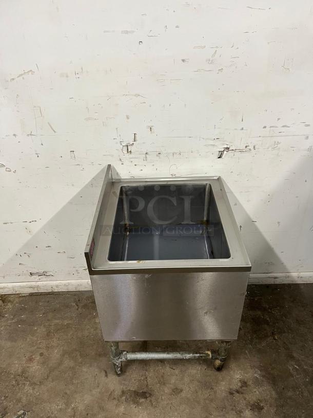 24-inch COLD PLATE ice bin, stainless steel with drain. Slightly worn condition. Ideal for commercial use.