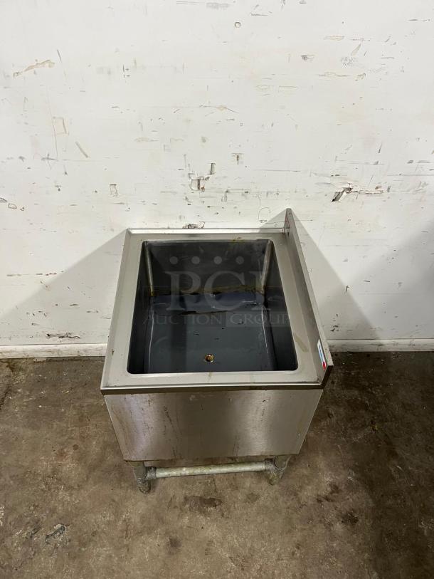 24-inch stainless steel ice bin with drain by COLD PLATE, shows signs of use; suitable for commercial settings.