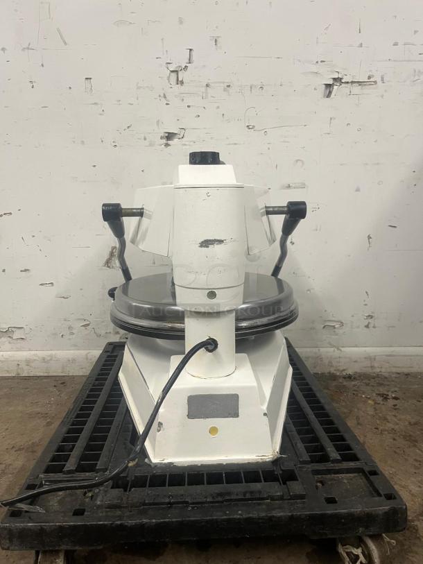 DOUGH PRO PIZZA PRESS DP1100, sturdy design, manual lever, visible wear, ideal for commercial kitchen use.