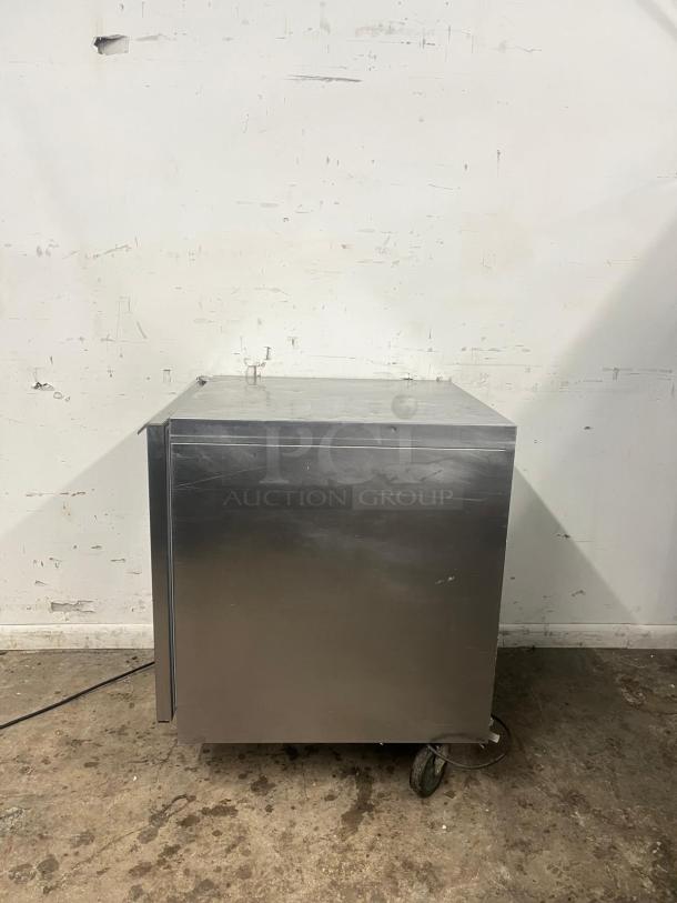 Traulsen UHT27-L 27" undercounter refrigerator, left hinged door, stainless steel exterior, on casters, used condition.
