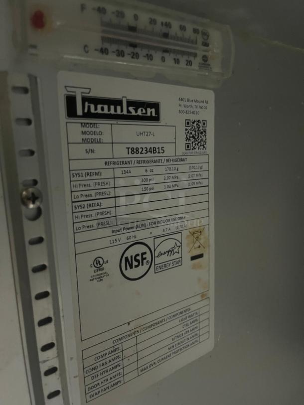 TRAULSEN UHT27-L undercounter refrigerator label, serial T88234B15, energy-efficient, NSF certified.