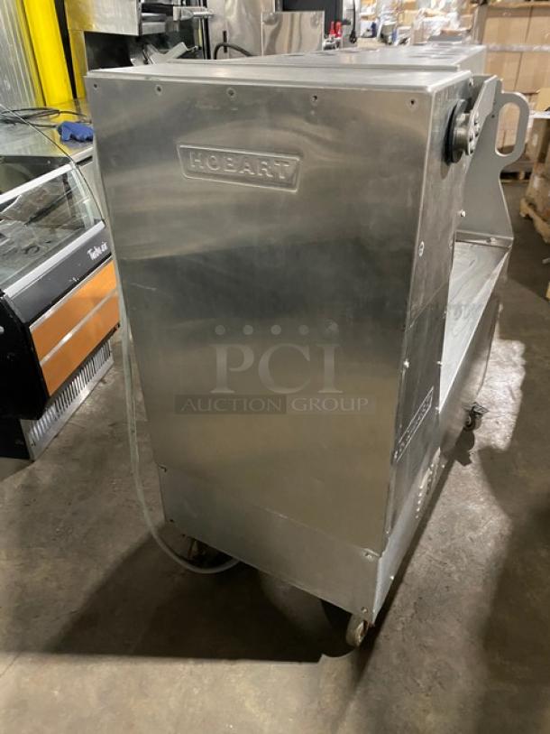 Hobart MG1532-1 meat mixer/grinder, stainless steel, 150 lb capacity, 208V 3-phase, on casters, includes air-drive foot switch.