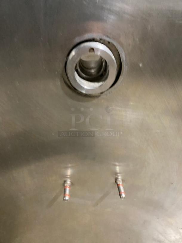 Close-up of the interior of a Taylor CH03-27 gelato machine, showing metal components and valve. Stainless finish, visible mounting.