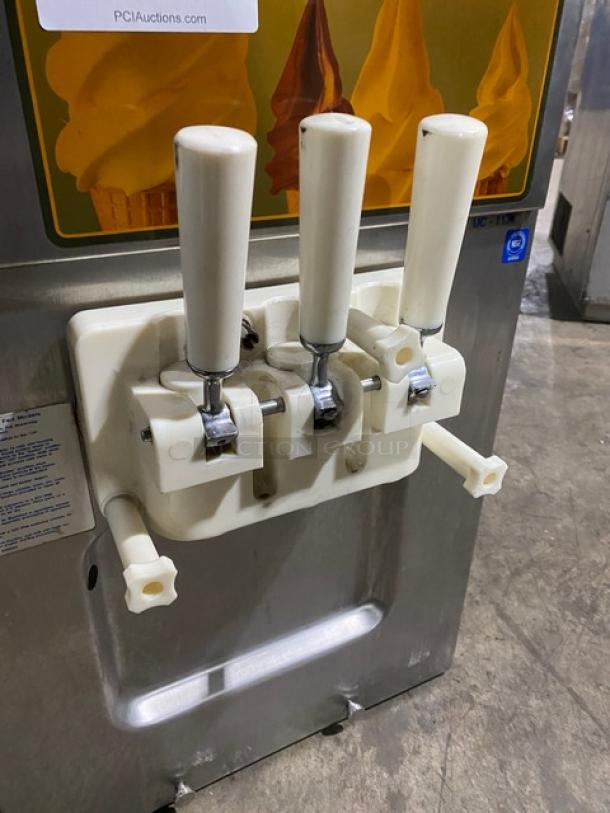 Coldelite UC1131G twin/twist soft serve machine with white handles, stainless steel finish, and two hoppers. Model: UC1131/G.