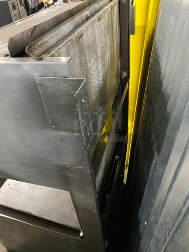 Jade Range commercial stainless steel gas-powered upright multi-cooking range with plancha griddle, backsplash, salamander broiler, and universal wire slide.