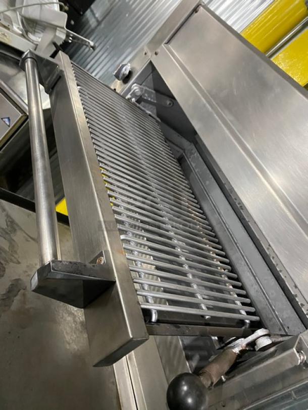 Jade Range commercial stainless steel gas cooking range with plancha top, backsplash, salamander broiler.