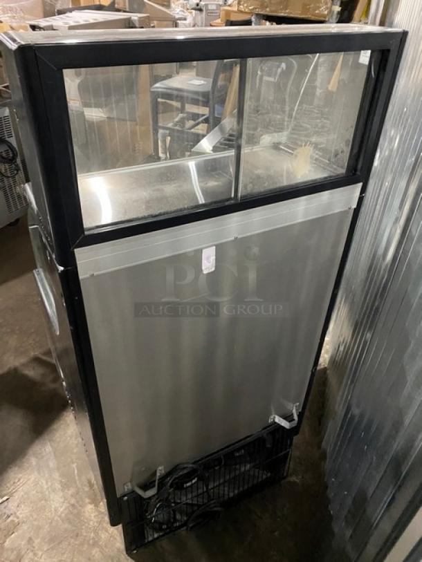 Turbo Air TOM-30LB commercial refrigerated display case with stainless interior, dry display case, and sliding doors.