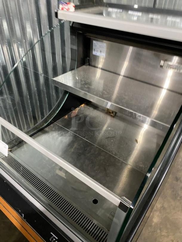 Turbo Air TOM-30LB merchandiser display case with stainless steel interior, multi-tier shelves, and sliding doors. 120V, 1 phase.