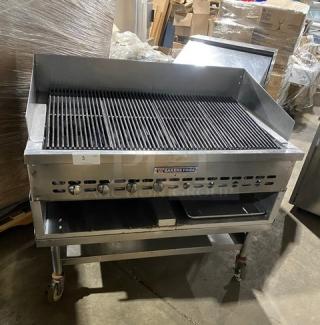 Bakers Pride stainless steel gas char broiler with back & side splash, single undershelf, on casters, excellent condition.