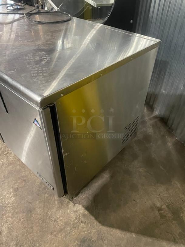 Everest ETBR3 stainless steel 3-door undercounter refrigerator, includes poly-coated wired rack, on casters, 115V 1 Phase.