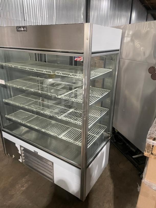 Leader stainless steel glass multi-tier refrigerated bakery display case with adjustable wire racks and rear sliding doors.