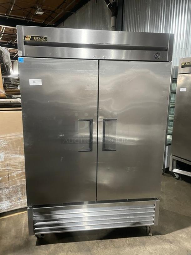 True T-49F commercial stainless steel 2-door reach-in freezer, Energy Star certified, poly coated racks, on casters.