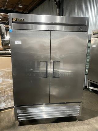 True T-49F commercial stainless steel 2-door reach-in freezer, Energy Star certified, poly coated racks, on casters.