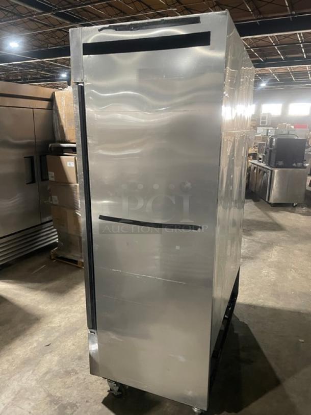 True commercial stainless steel 2-door reach-in freezer, Model T-49F, on casters, with poly-coated wired racks, Energy Star certified.