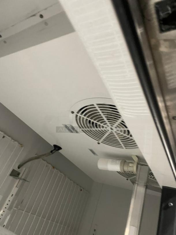 True T-49F commercial stainless steel 2-door reach-in freezer interior, visible poly coated wired racks, Energy Star certified.