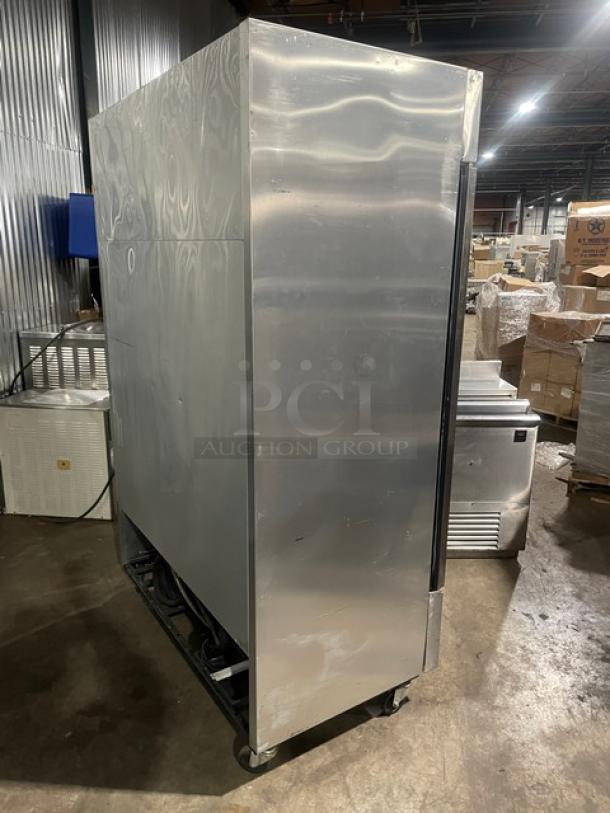 True Commercial Stainless Steel 2-Door Reach-In Freezer, Model T-49F, on casters, with poly coated wired racks, SN: 8493819.