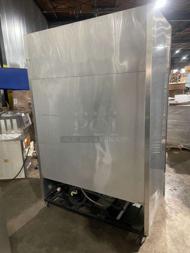 True T-49F commercial stainless steel 2-door reach-in freezer, on casters, with poly-coated wire racks, SN: 8493819.