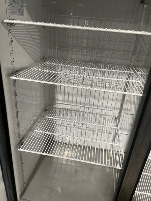 True T-49F stainless steel 2-door freezer, poly-coated wire racks, on casters, model T-49F, SN: 8493819, 115V, excellent condition.