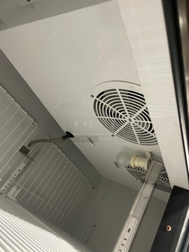 True T-49F Commercial Freezer, stainless steel, two doors, poly coated wire racks, SN: 8493819, 115V 1 Phase, on casters.