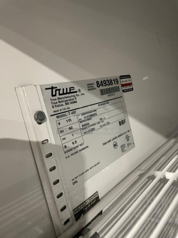 True T-49F commercial stainless steel 2-door reach-in freezer with poly coated wired racks, 115V, on casters, SN: 8493819.