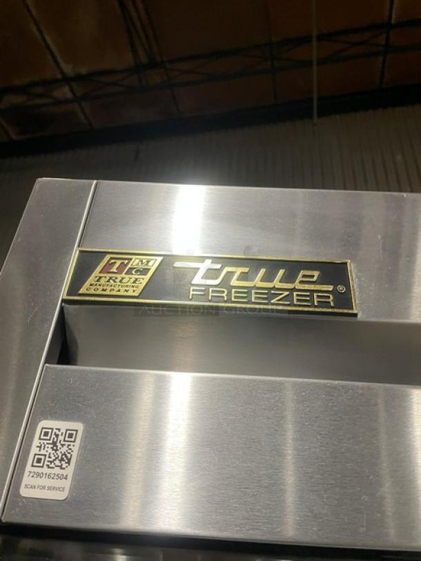 True T49F stainless steel 2-door reach-in freezer, commercial grade, on casters, with poly coated wire racks. Model T49F, SN: 8493819.