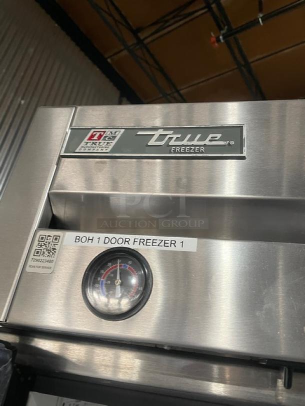 True T-23F single door reach-in freezer, stainless steel, Energy Star certified, analog temperature gauge, tags visible.