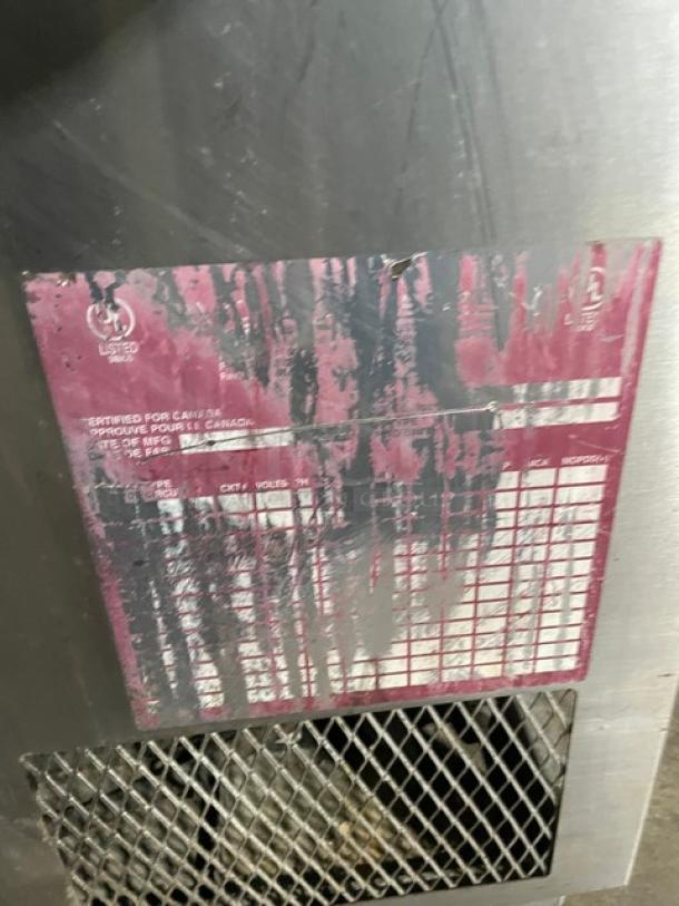 Commercial stainless steel bottle/glass chiller with worn certification label and vent. Good condition, ideal for bars.