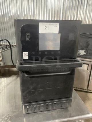 Late model MerryChef black electric countertop high-speed rapid cook oven, in good condition, with visible control panel.