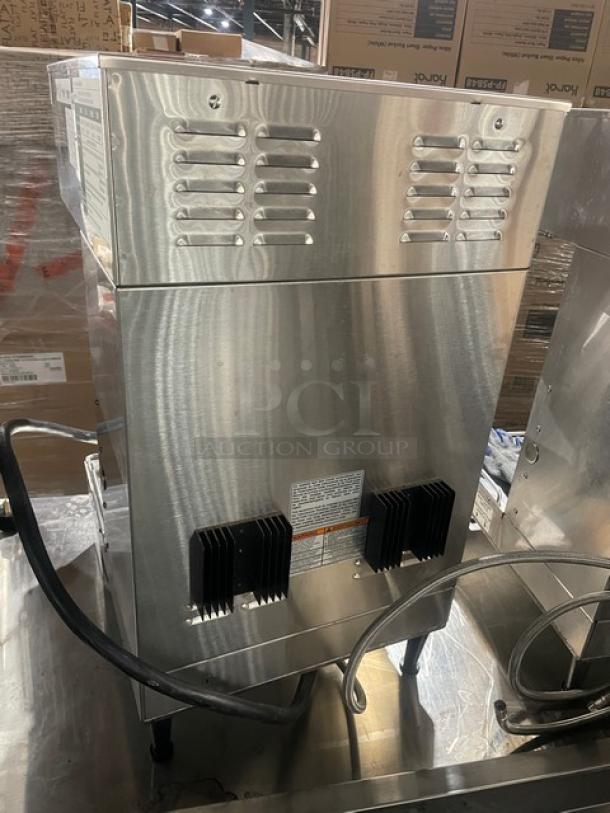 Bunn DUALSHDBC dual coffee brewer, stainless steel, countertop model; 120/208V, 1 Phase. Excellent condition, visible vents and power cords.