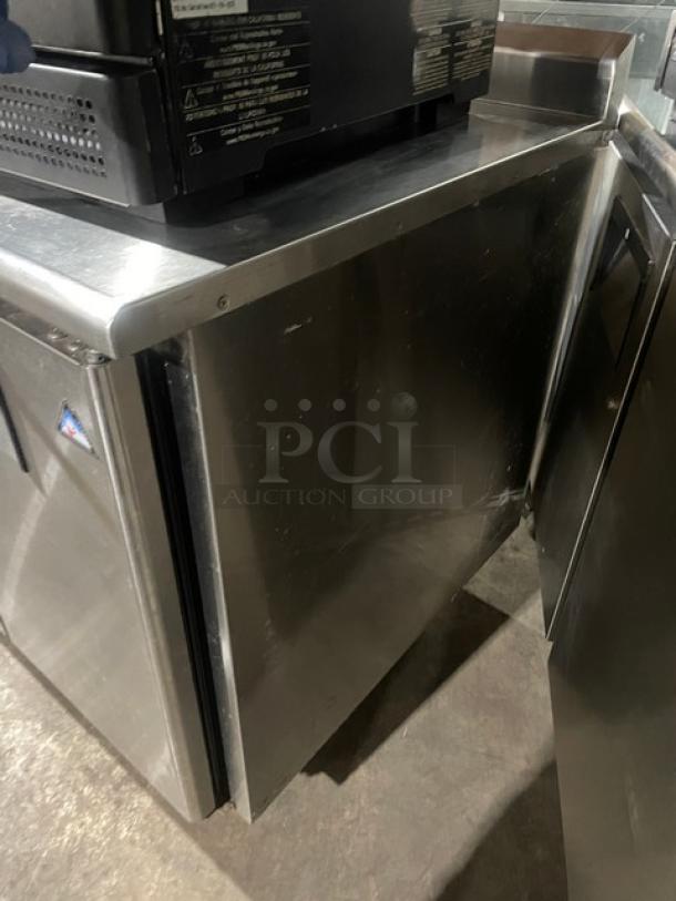 Everest Refrigeration stainless steel undercounter worktop table, model ETRF3, with poly-coated rack, on casters.