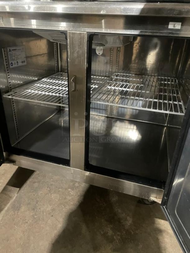 Everest ETRF3 stainless steel refrigerated undercounter worktop table with poly-coated wired rack, model ETRF3, on casters.