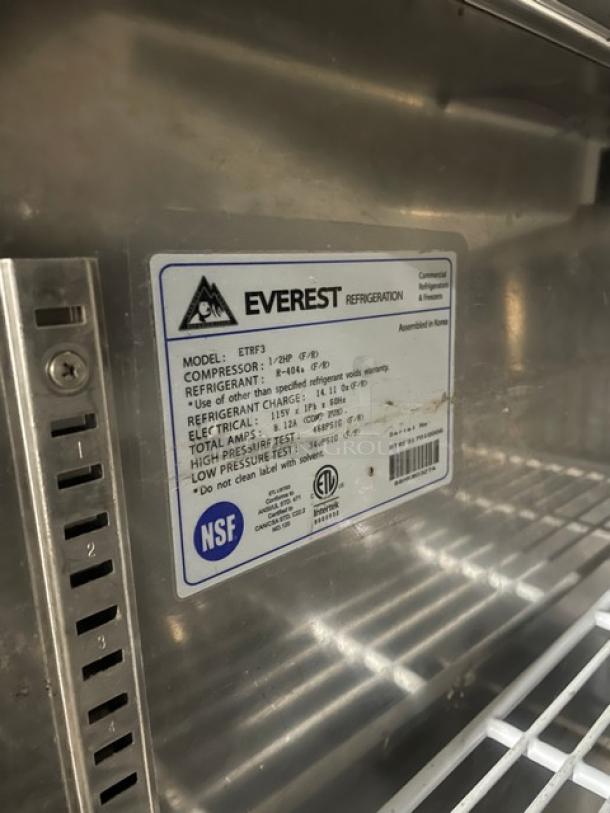 Everest Refrigeration ETRF3 stainless steel refrigerated undercounter worktop table, features poly coated rack, on casters.