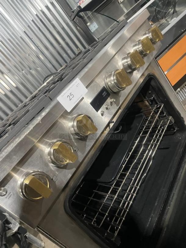 Monogram stainless steel 6-burner range/oven combo with wired oven rack, commercial-grade, on legs, excellent condition.