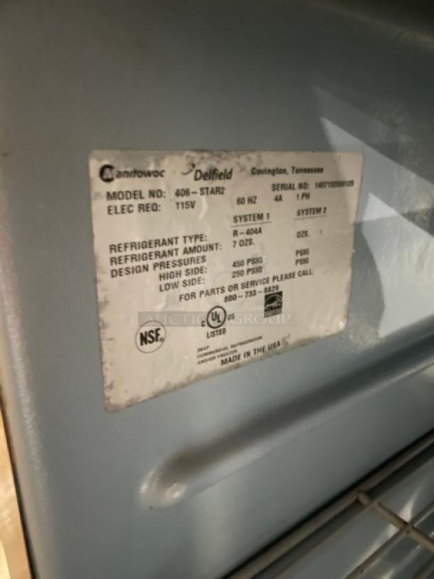 Delfield 406-STAR2 commercial undercounter refrigerator, stainless steel, with poly coated wire rack. Model label details specs.