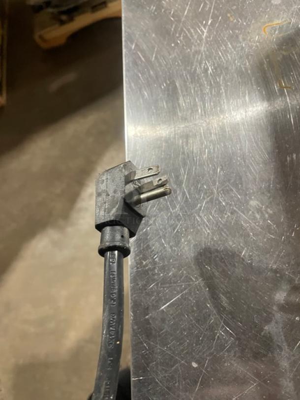 Turbo Air M3 Series refrigerated prep table plug on stainless steel surface, model MST2812, 115V, on casters.