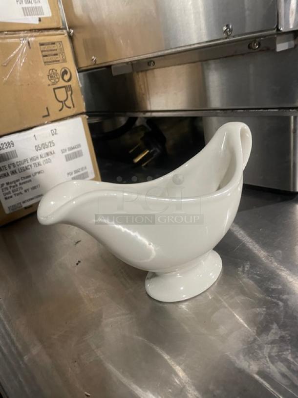 Commercial white 7-3/4 oz. sauce/gravy boat, model 1138, new condition, ceramic, elegant design, sold by the dozen.