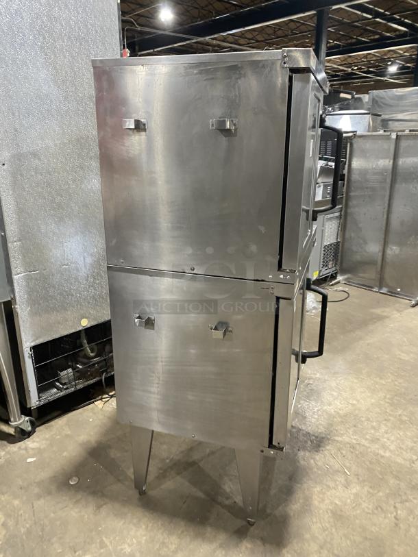 Vulcan commercial stainless steel double stacked gas convection oven with wired oven rack, on legs. Used, sturdy condition.