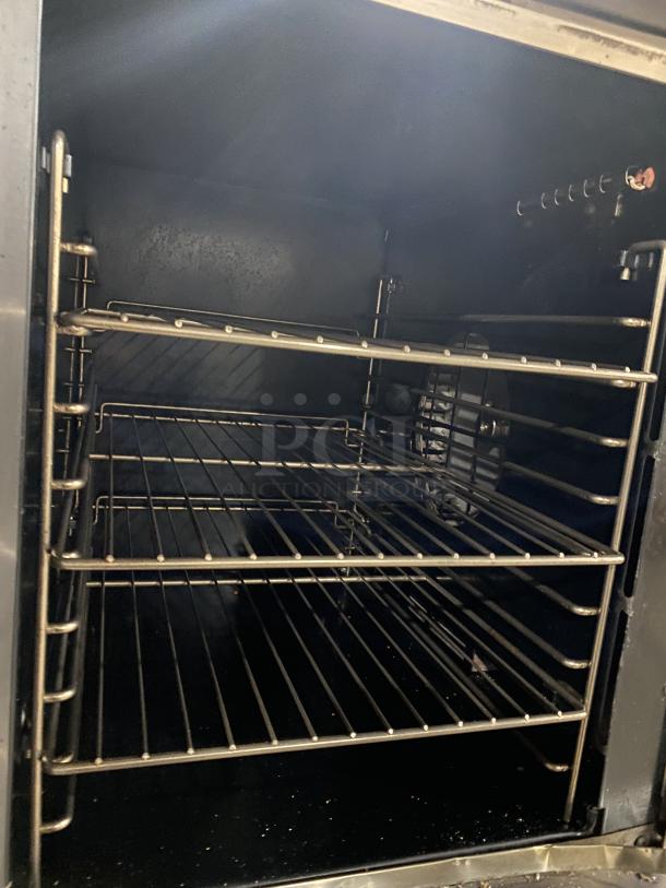 Vulcan commercial stainless steel double stacked convection oven with wired oven rack, in good condition.