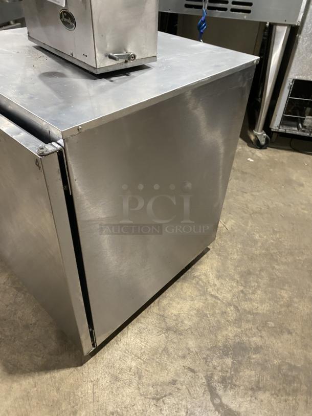 Delfield stainless steel undercounter refrigerator model 406CADD1, single door, poly-coated wire racks, on casters, 115V.