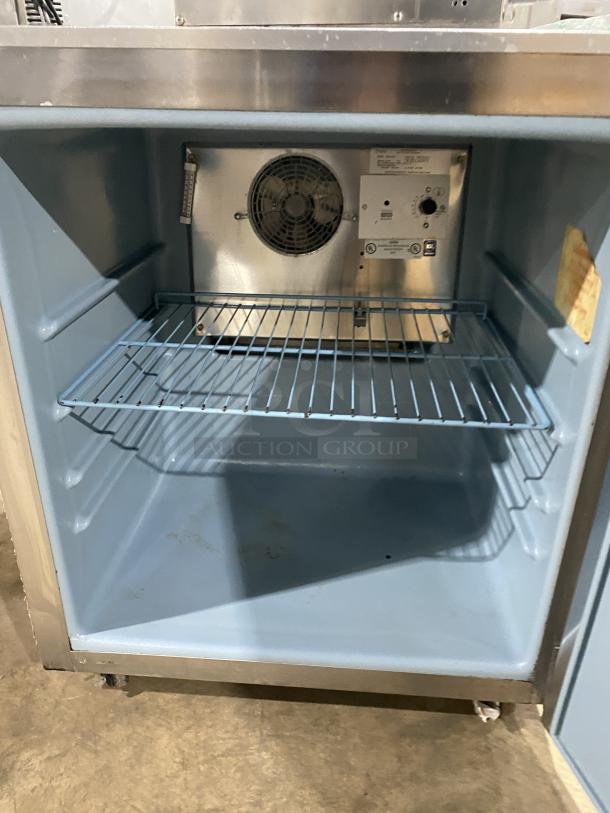 Delfield 406CA-DD1 Stainless Steel Undercounter Refrigerator, single door, poly coated wire racks, on casters, 115V, used.