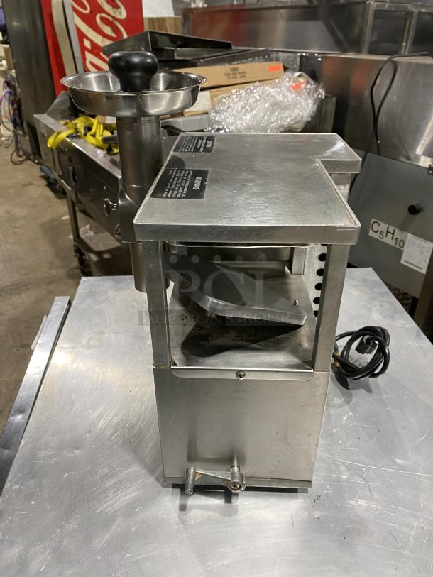 Norwalk 275SS commercial stainless steel countertop cold press juicing machine, two-stage hydraulic press, visible labels.